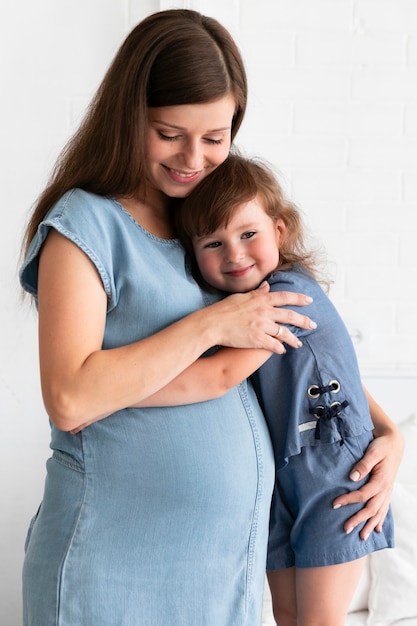 Mother hugging her daughter 