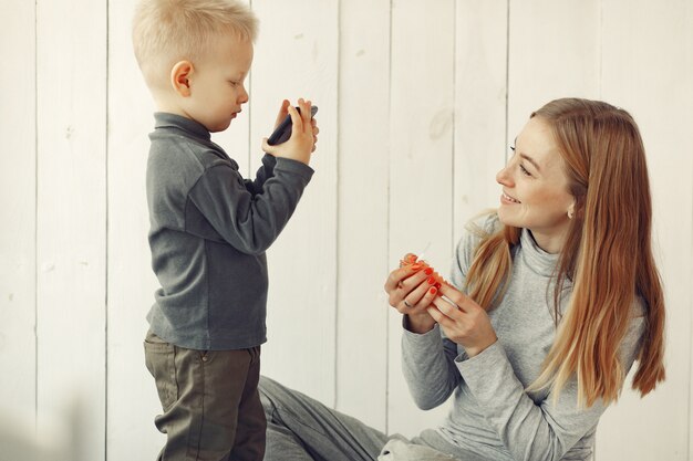 Mother and little son playing at home