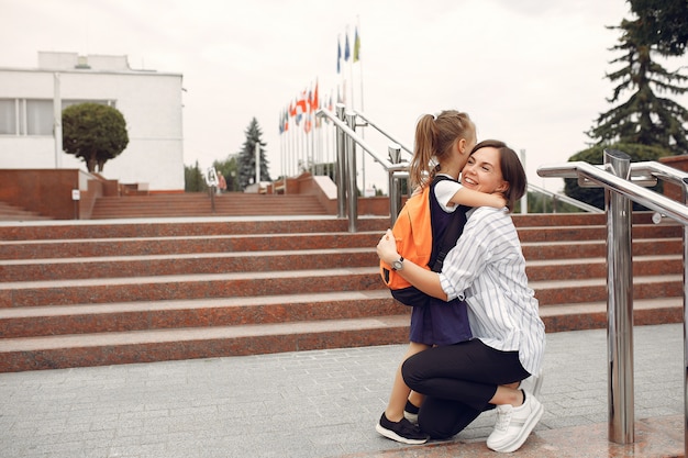 Free photo mother prepare little daughter to school