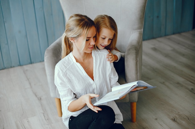 Free photo mother reading a book with daughter