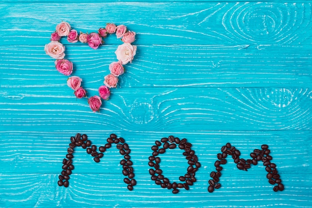 Free photo mother's day composition with flowers and coffee beans