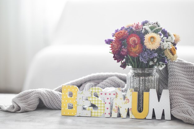 Mother's day holiday wall, with flowers and lettering.