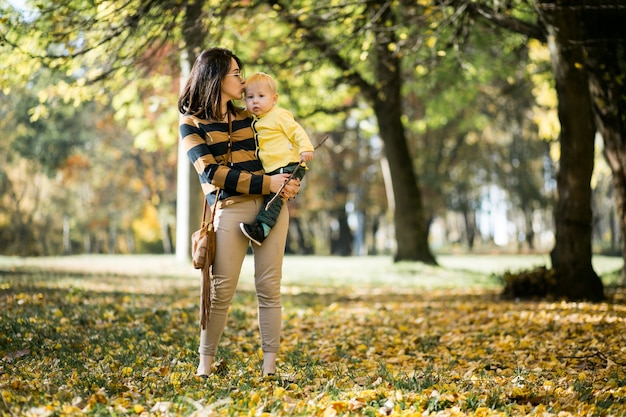 Mother and son in autumn park