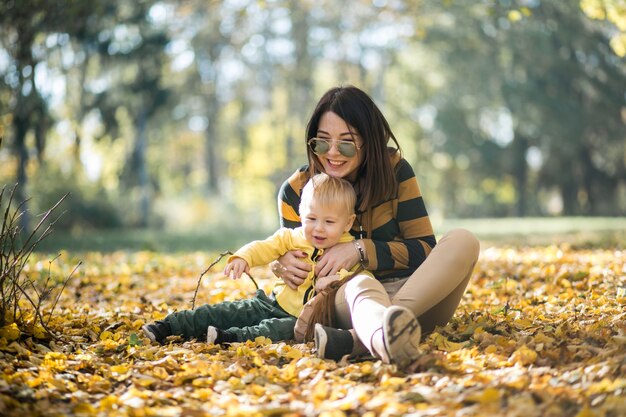 Mother and son in autumn park