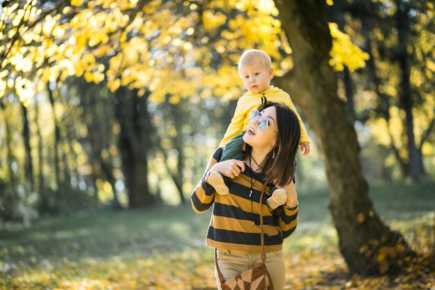 Mother and son in autumn park