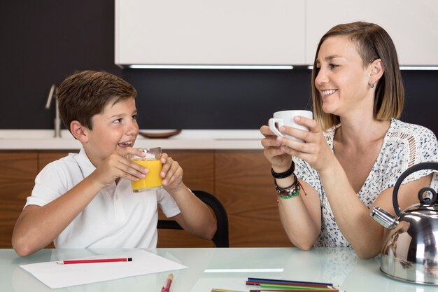 Mother and son having a snack together