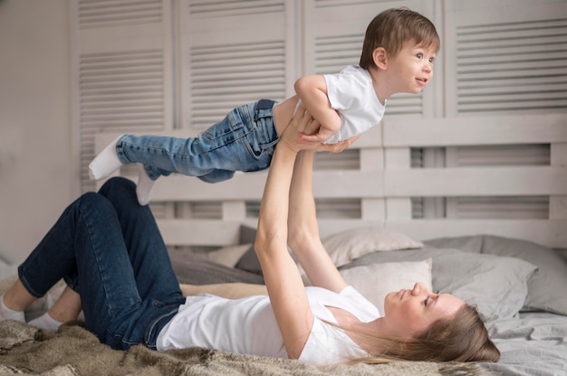 Mother and son playing airplane game