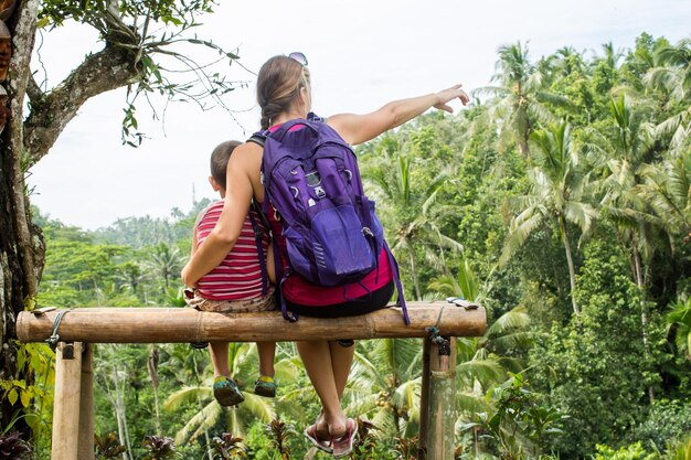 Mother and son watching the view of rice fields in Ubud Bali