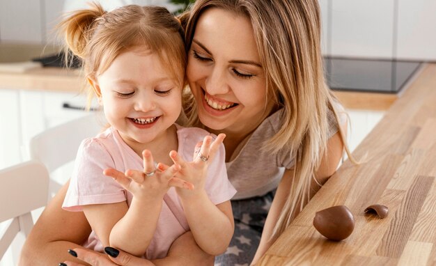 Mother spending time together with her daughter at home