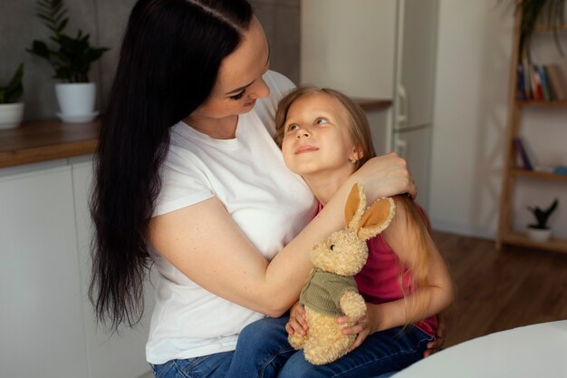 Mother taking care of child with head lices