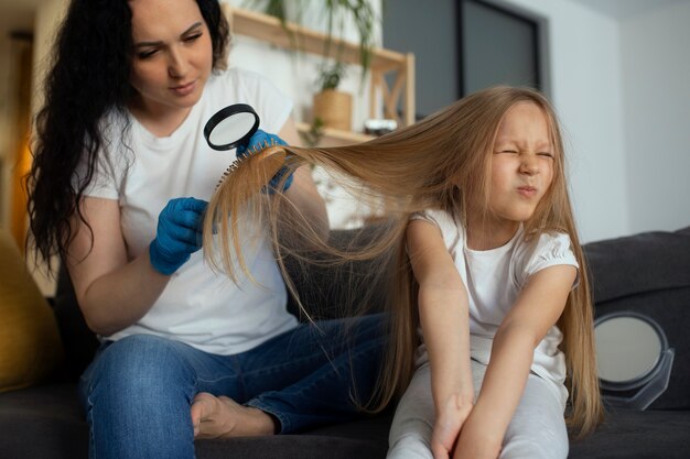 Free Photo mother taking care of child with head lices