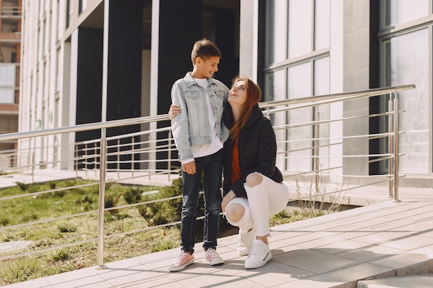 Mother with children in a city