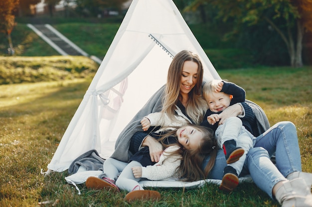 Free photo mother with children playing in a summer park