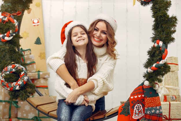 Mother with cute daughter in a christmas decorations