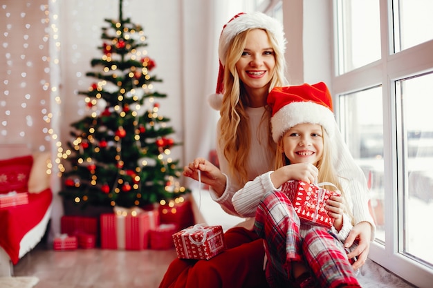 Mother with cute daughter at home