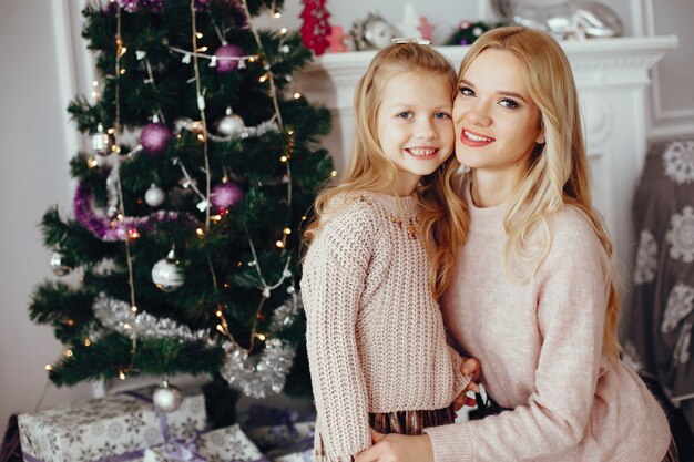 Mother with cute daughter at home