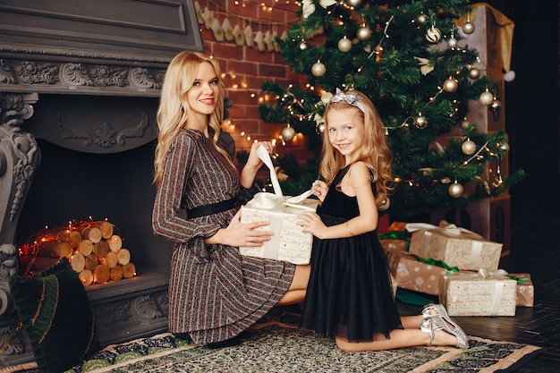 Mother with cute daughter at home