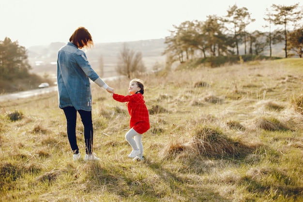 mother with daughter in a forest