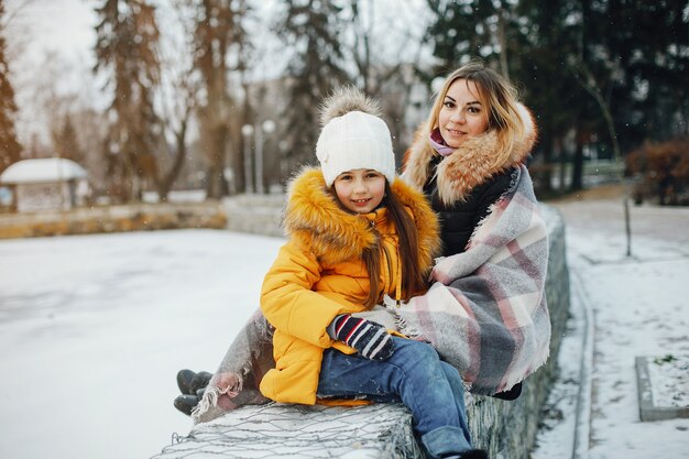 Mother with daughter in a park