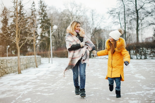 Mother with daughter in a park