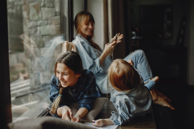 Mother with daughters at home