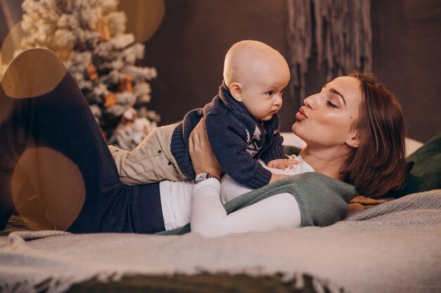 Mother with her baby boy celebrating christmas