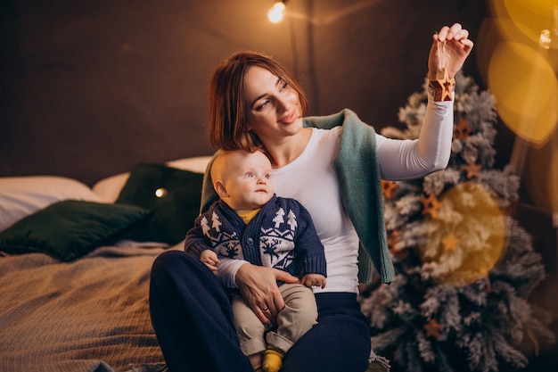 Mother with her baby boy celebrating christmas