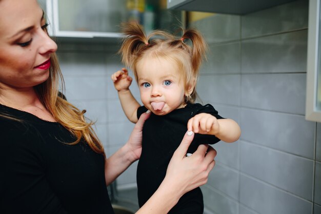 Mother with her daughter in hands