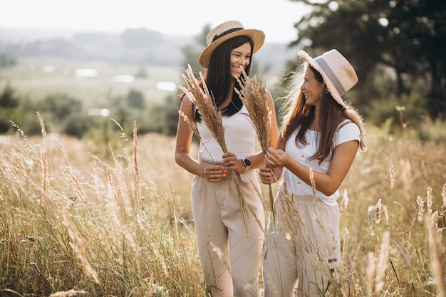 Mother with her daughter together in field