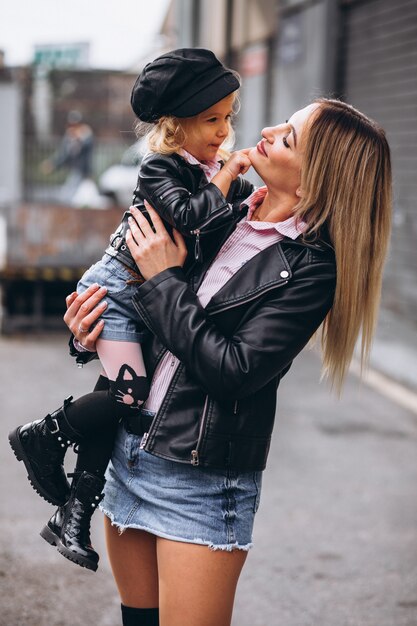 Mother with her little baby daughter outside the street