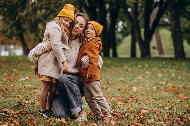 Free photo mother with kids having fun in park