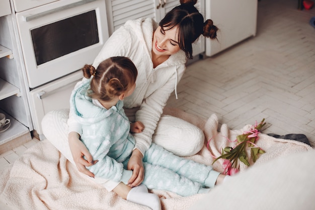 Mother with little child at home