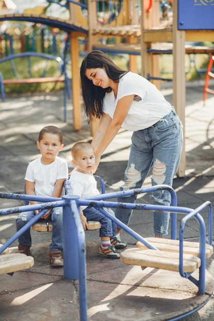 Free photo mother with little child on a playground