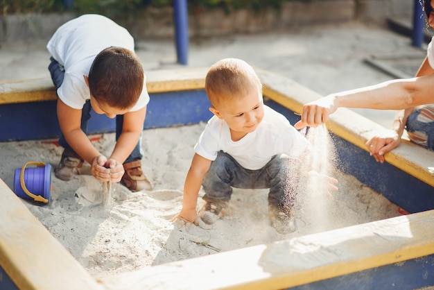 Free photo mother with little child on a playground