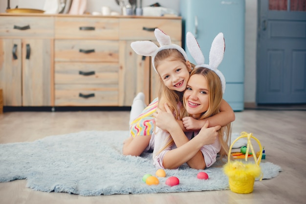 Mother with little daughter in a kitchen