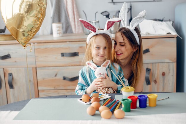 Mother with little daughter in a kitchen