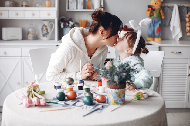 Mother with little daughter in a kitchen