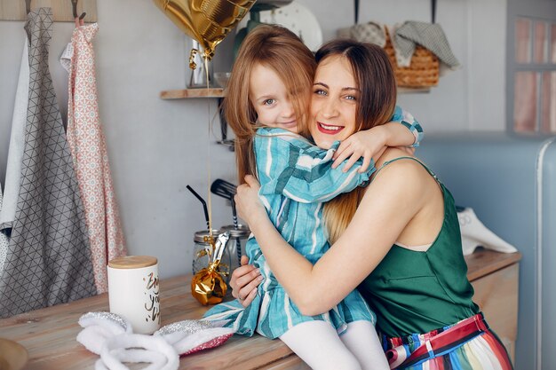 Mother with little daughter in a room