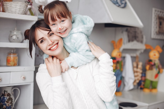 Mother with little daughter in a room