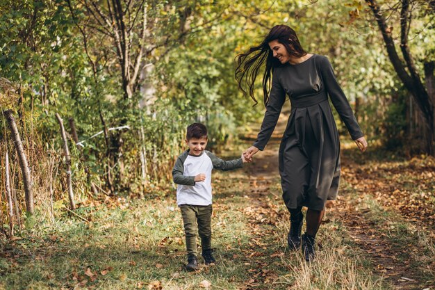 Mother with little son in an autumn park