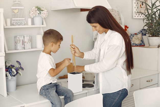 Mother with little son having fun at home