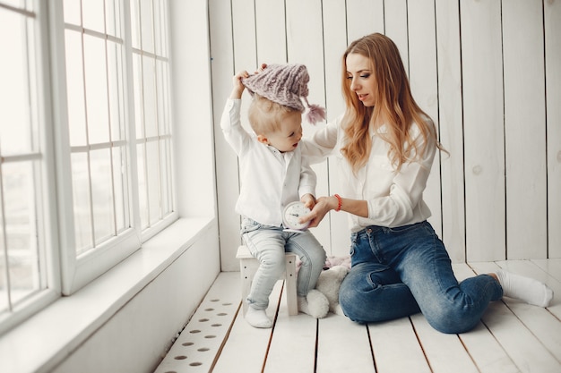 Free photo mother with little son in a room