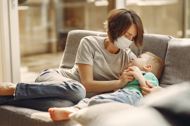 Mother with littler son sitting at home on quarantine