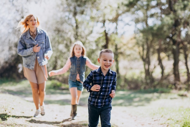 Free photo mother with son and daughter together in the park