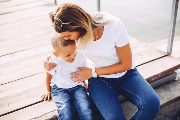 Mother with son playing in a summer park