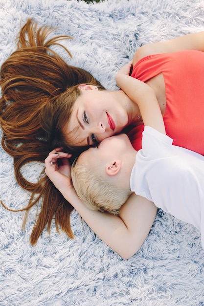 Mother with son playing in a summer park