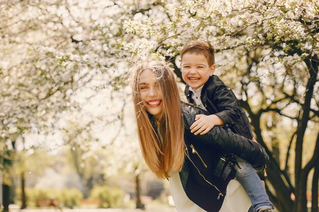 Mother with son playing in a summer park