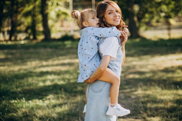 Mother woith baby girl having fun in park