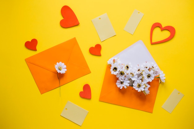 Free photo mothers day composition with orange envelopes