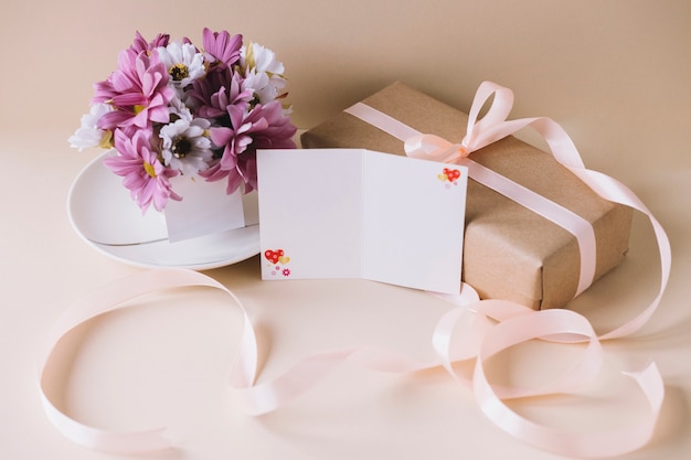 Mothers day composition with present box and flowers